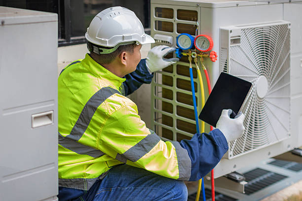 Professional Heat Pump Repair technician working in Raynham, MA